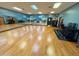 Bright mirrored aerobics room featuring hardwood floors for training activities and group fitness at 202 Verrazano Pl, Clayton, NC 27520