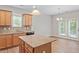 Bright kitchen with granite countertops, wooden cabinets and stainless steel sink at 202 Verrazano Pl, Clayton, NC 27520