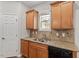 Close-up of sink and granite countertop in the kitchen at 202 Verrazano Pl, Clayton, NC 27520