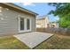 Outdoor patio for relaxation and entertaining near a well-maintained fenced yard with healthy green grass at 202 Verrazano Pl, Clayton, NC 27520