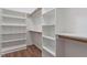 Walk-in closet with shelving and racks provides ample storage and organization space at 202 Verrazano Pl, Clayton, NC 27520