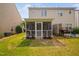 Private backyard with a screened-in porch, patio, and well-maintained lawn for outdoor enjoyment at 2040 Persimmon Ridge Dr, Raleigh, NC 27604