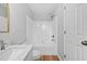 Well-lit bathroom featuring a shower-tub combo and a modern vanity at 2040 Persimmon Ridge Dr, Raleigh, NC 27604