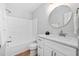 Clean bathroom with a shower-tub combo and a modern vanity featuring a quartz countertop at 2040 Persimmon Ridge Dr, Raleigh, NC 27604