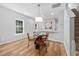 Light and airy dining area with room for four and lots of natural light and wood look floors at 2040 Persimmon Ridge Dr, Raleigh, NC 27604