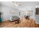 Open concept floor plan with a living room, dining area, wood look floors, and lots of natural light at 2040 Persimmon Ridge Dr, Raleigh, NC 27604