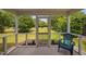 Relaxing screened-in porch with comfortable seating and views of the lush green lawn at 2040 Persimmon Ridge Dr, Raleigh, NC 27604