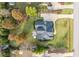 Aerial view of a well-maintained property with a large driveway and lush landscaping, showcasing its layout at 2100 Stone Pasture Rd, Fuquay Varina, NC 27526
