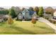Beautiful home with a large yard and mature landscaping, offering privacy and curb appeal at 2100 Stone Pasture Rd, Fuquay Varina, NC 27526