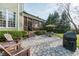 Spacious stone patio, with seating, grill, and entrance to the screened in porch at 2100 Stone Pasture Rd, Fuquay Varina, NC 27526