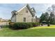 Lush backyard featuring a screened porch, privacy landscaping, and an outdoor patio perfect for entertaining at 2100 Stone Pasture Rd, Fuquay Varina, NC 27526