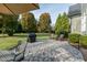 Backyard features lush lawn, shade trees, patio, and grill at 2100 Stone Pasture Rd, Fuquay Varina, NC 27526
