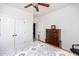 Bright bedroom with traditional-style furniture, ceiling fan and white double closet doors at 2100 Stone Pasture Rd, Fuquay Varina, NC 27526