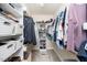 Walk-in closet with custom shelving and rack system for organized storage at 2100 Stone Pasture Rd, Fuquay Varina, NC 27526