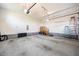 Spacious three-car garage with stairs to upper level provides ample storage and workspace at 2100 Stone Pasture Rd, Fuquay Varina, NC 27526