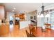 Open kitchen with stainless appliances, breakfast bar, and access to the breakfast nook and living room at 2100 Stone Pasture Rd, Fuquay Varina, NC 27526