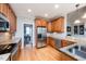 Traditional kitchen boasts stainless steel appliances, granite countertops, and wooden cabinetry at 2100 Stone Pasture Rd, Fuquay Varina, NC 27526
