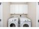 Clean laundry area with two new, front-loading, Samsung, high efficiency washing machines at 2100 Stone Pasture Rd, Fuquay Varina, NC 27526