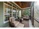 Inviting screened porch with wicker furniture, wood ceiling, and view of backyard at 2100 Stone Pasture Rd, Fuquay Varina, NC 27526