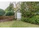 Charming shed with a decorative star accent and double doors, surrounded by mature landscaping at 2100 Stone Pasture Rd, Fuquay Varina, NC 27526
