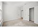 Neutral bedroom featuring carpet floors, closet, and bright natural light at 214 George Pine Way, Knightdale, NC 27545