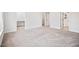 Spacious bedroom with neutral carpeting and multiple doorways at 214 George Pine Way, Knightdale, NC 27545
