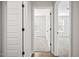Hallway featuring neutral paint and wood floors, leading to several rooms in the house at 214 George Pine Way, Knightdale, NC 27545