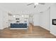 Open-concept living and kitchen area with stainless steel appliances, a modern island, and recessed lighting at 214 George Pine Way, Knightdale, NC 27545