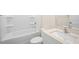This is a bathroom with a shower-tub combo and a vanity with a white countertop at 228 Palomino Way, Clayton, NC 27520