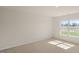 Bedroom with carpet, light walls, large window for natural light at 228 Palomino Way, Clayton, NC 27520
