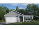 Charming one-story home featuring a gray exterior, a two-car garage, and a well-manicured front yard at 228 Palomino Way, Clayton, NC 27520