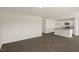 This is a living room and kitchen with wood-look floors and modern appliances at 228 Palomino Way, Clayton, NC 27520