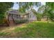 Backyard featuring a deck, screened porch and grassy area at 2312 Shallowford Ln, Chapel Hill, NC 27517