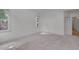 Bright bedroom with neutral carpet, white walls, and natural light from two windows at 2312 Shallowford Ln, Chapel Hill, NC 27517