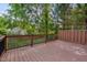 Wood deck featuring a dark wood fence and backyard views at 2312 Shallowford Ln, Chapel Hill, NC 27517