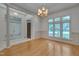 Dining area with hardwood floors, natural light, and views into the entry at 2312 Shallowford Ln, Chapel Hill, NC 27517