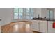 Bright kitchen eating area featuring a breakfast bar and a breakfast nook overlooking the backyard at 2312 Shallowford Ln, Chapel Hill, NC 27517