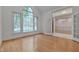 Spacious living room with hardwood floors and French doors at 2312 Shallowford Ln, Chapel Hill, NC 27517