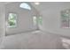 Spacious main bedroom with bright windows and a ceiling fan offers a peaceful retreat at 2312 Shallowford Ln, Chapel Hill, NC 27517