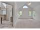 Main bedroom featuring high ceilings, plenty of light, and access to main bathroom at 2312 Shallowford Ln, Chapel Hill, NC 27517