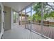 Comfortable screened porch with wood flooring and backyard views through the screen at 2312 Shallowford Ln, Chapel Hill, NC 27517