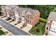 Brick townhomes boast manicured lawns, attached garages, and convenient street parking at 2740 Laurelcherry St, Raleigh, NC 27612