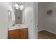 Bathroom with vanity, medicine cabinet, sink and an open door to a storage area at 2740 Laurelcherry St, Raleigh, NC 27612