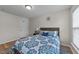 Inviting bedroom showcasing a queen-sized bed, hardwood floors, and a window for natural light at 2740 Laurelcherry St, Raleigh, NC 27612