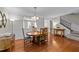Charming dining room boasts hardwood floors and a traditional wooden table set at 2740 Laurelcherry St, Raleigh, NC 27612
