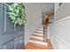 Elegant entryway showcases hardwood floors, staircase, and decorative wainscoting at 2740 Laurelcherry St, Raleigh, NC 27612