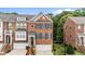 Charming brick townhome features a well-manicured lawn, attached garage and decorative shutters at 2740 Laurelcherry St, Raleigh, NC 27612