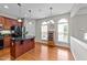Bright eat-in kitchen with wood floors, a center island and stainless-steel appliances at 2740 Laurelcherry St, Raleigh, NC 27612