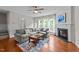 Inviting living room features a cozy fireplace, large sectional sofa, and lots of natural light at 2740 Laurelcherry St, Raleigh, NC 27612