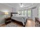 Beautiful bedroom has tray ceiling, hardwood floors, and natural light from a large window at 2740 Laurelcherry St, Raleigh, NC 27612